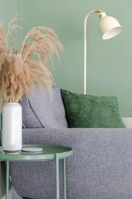 a purple couch with a table and a lamp at Stylish 3-Bed Home - 2 Mins to Beach & Town in Falmouth