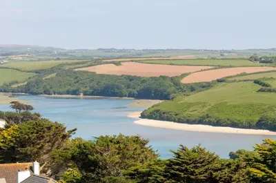 an aerial view of a river with a beach at Little Beachside in Newquay