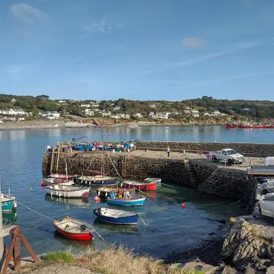 a group of boats are docked in a harbor at Harbour Views, Coverack in Helston