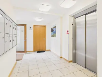 an empty hallway with a door in a building at 1 Arvor – Two-Bedroom Apartment with Parking at Maenporth Beach! Cornwall in Falmouth