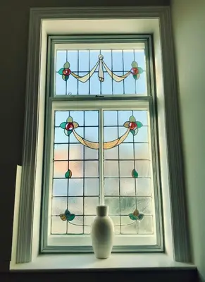 a glass window with a vase in front of it at No 1 Exbury Padstow in Padstow