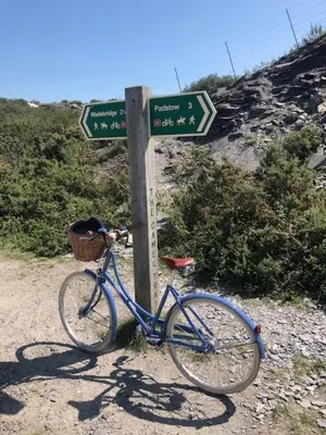 a blue bike parked next to a street sign at No 1 Exbury Padstow in Padstow