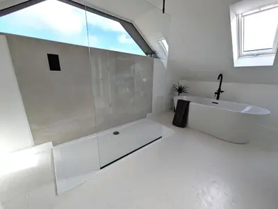 a white bathroom with a tub and a sink at Cober Riverside Retreat - Luxury Barn Apartment in The Heart of Cornwall in Wendron