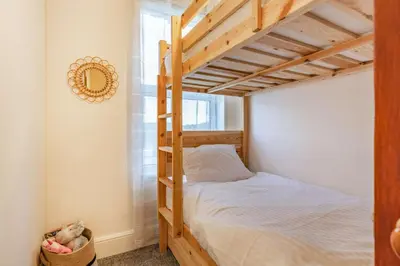 a bedroom with a bunk bed in a room at 4 Bed in St. Austell oc-t32965 in St Austell