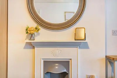 a mirror above a fireplace in a room at 4 Bed in St. Austell oc-t32965 in St Austell