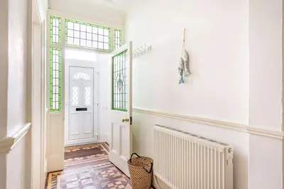 a hallway with white walls and a white door at 4 Bed in St. Austell oc-t32965 in St Austell