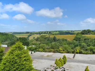 an aerial view of a garden with trees at Valley View - Uk50320 in Liskeard