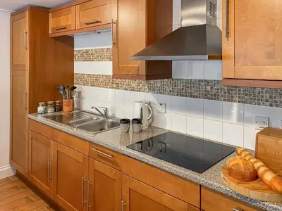 a kitchen with a sink and a counter top at Dune Cottage - Uk48934 in Saint Erth