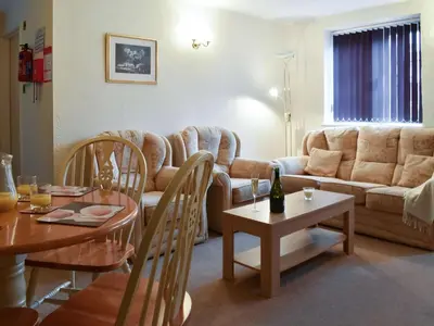 a living room with a couch and a table at Henhouse - Uk49016 in Liskeard
