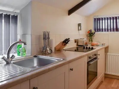 a kitchen with a sink and a counter top at Henhouse - Uk49016 in Liskeard