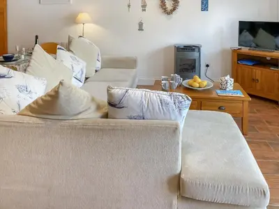 a living room with a couch and a table at Atlantic Cottage - Uk48935 in Saint Erth