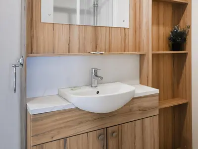 a bathroom with a white sink and a mirror at Edmonton Lodge - Uk50308 in Doublebois