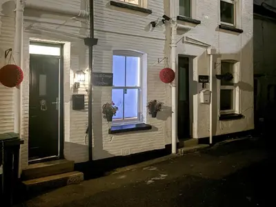 a window on the side of a house at Seagull Cottage in Looe