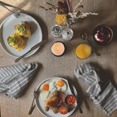 a table with two plates of breakfast food on it at The Copley Arms in Downderry