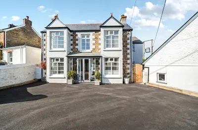 a house with a driveway in front of it at Idyllic Cornish House in St. Agnes