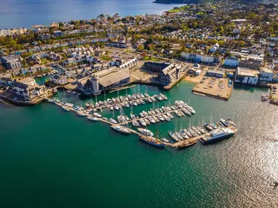 an aerial view of a harbor with boats in the water at The Crows Nest – Sea View Retreat, Flushing Cornwall in Falmouth