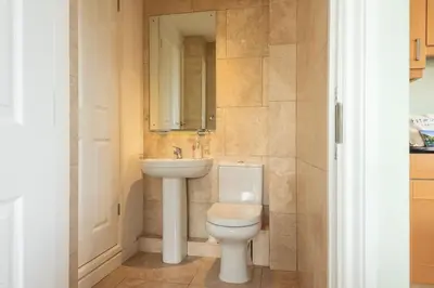 a bathroom with a toilet and a sink at White Horses in Port Isaac