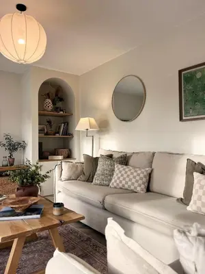 a living room with a couch and a table at SeaNest and cabin, walk to beach in St. Agnes