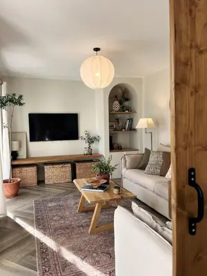 a living room with a couch and a table at SeaNest and cabin, walk to beach in St. Agnes