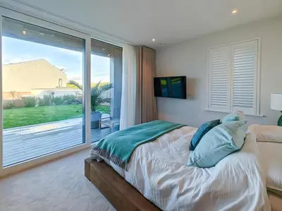 a bedroom with a bed and a large window at 3 Bed in Constantine Bay oc-t34218 in St Merryn