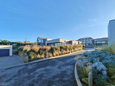 a house with a driveway with plants and buildings at 3 Bed in Constantine Bay oc-t34218 in St Merryn