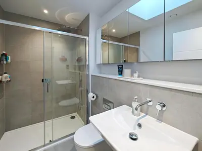 a bathroom with a shower and a sink and a toilet at 3 Bed in Constantine Bay oc-t34218 in St Merryn