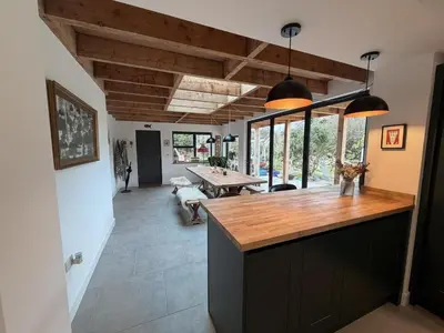 a kitchen with a wooden counter top and a table at 4 Bed in Bugle oc-f34175 in Penwithick