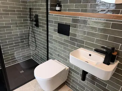 a bathroom with a toilet and a sink at 4 Bed in Bugle oc-f34175 in Penwithick