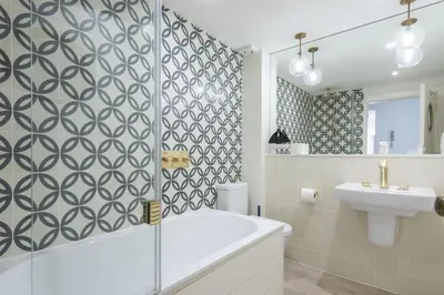 a bathroom with a tub and a sink at Emerald - Stunning Views - Free Parking and WiFi - Coffee Machine in Carbis Bay
