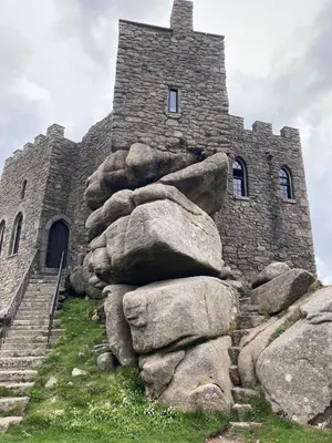 a stone building with some rocks in front of it at Church View, Helston Old Town in Helston