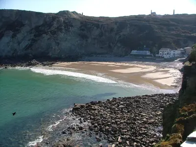 a view of a beach with rocks and the ocean at Atlantic House En-Suite Bedrooms 5 mins to Beach and Shops in St. Agnes