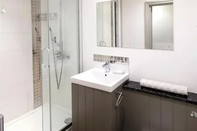 a bathroom with a sink and a shower at Atlantic House En-Suite Bedrooms 5 mins to Beach and Shops in St. Agnes