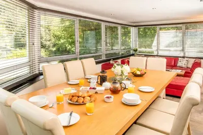 a dining room with a table and chairs at Atlantic House En-Suite Bedrooms 5 mins to Beach and Shops in St. Agnes