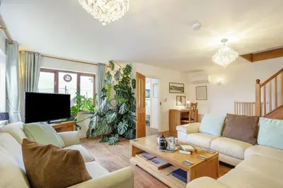 a living room with a couch and a table at 3 Bed in Polruan oc-l35010 in Fowey