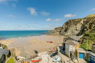 a beach with a group of people on the sand at 2 Bed in St. Agnes oc-h27472 in St. Agnes
