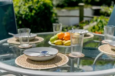 a glass table with bowls and plates of fruit on it at 2 Bed in St. Agnes oc-h27472 in St. Agnes