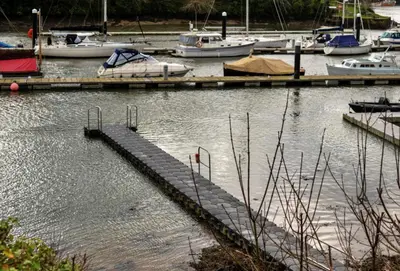 a group of boats docked in a marina at Finest Retreats - Captains Cottage at Mixtow Creek in Lanteglos