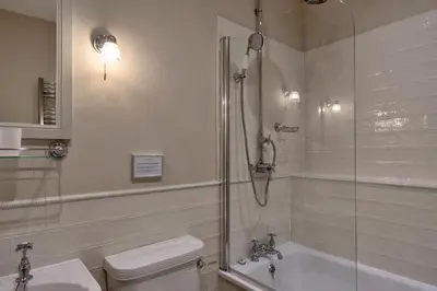 a bathroom with a shower and a toilet and a sink at Finest Retreats - Kits House at Mixtow Creek in Lanteglos