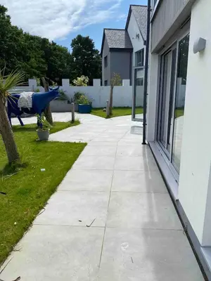 a concrete sidewalk next to a house at Detached 4 Bed House with large gardens and Hot Tub in St Merryn