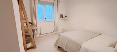 a white bedroom with a bed and a window at Calm Private Room Near Truro - Short Stays Welcome in Kea
