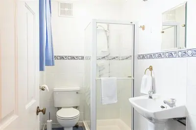 a white bathroom with a toilet and a sink at Providence House St Breward near coastbeaches in Saint Breward