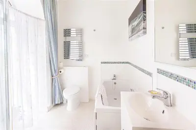 a white bathroom with a sink and a toilet at Providence House St Breward near coastbeaches in Saint Breward