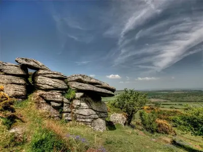 a rock formation on top of a grassy hill at Providence House St Breward near coastbeaches in Saint Breward