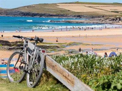 a bike parked on a fence next to a beach at Providence House St Breward near coastbeaches in Saint Breward