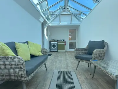 a living room with a couch and two chairs at Shellseekers lovely views across Port Isaac in Port Isaac