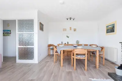 a dining room with a table and chairs at Shellseekers lovely views across Port Isaac in Port Isaac