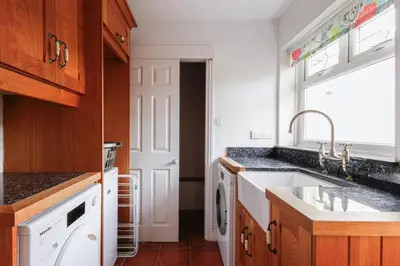 a kitchen with a sink and a dishwasher at Hazeldene amazing sea and countryside views in Crackington Haven
