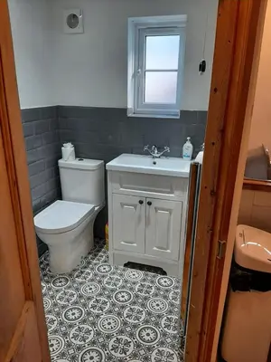 a bathroom with a toilet and a sink at 2 Umfula Place in St Ives