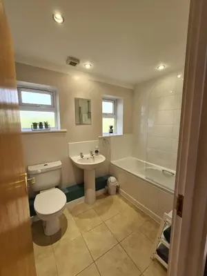 a bathroom with a toilet and a sink and a tub at Inny Glade in Davidstow