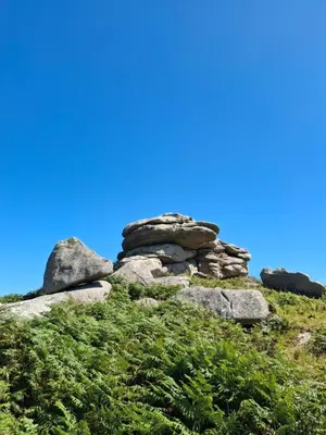 a pile of rocks on a grassy hill at The Cabin in Carbis Bay